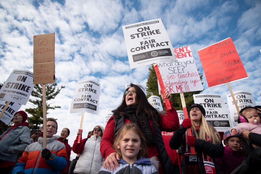 Jennifer Yen, special education teacher at Alexander Graham Bell School, joins the rally as Chicago Public Schools teachers picket, Thursday morning, Oct. 17, 2019, at Lane Tech High School in Chicago.