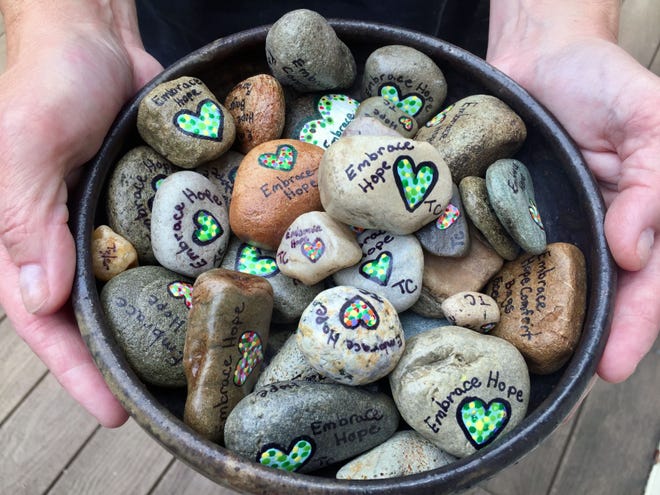 “Embrace Hope” hides stones painted with the words in parks and other public places to be discovered by someone who may be dealing with addiction.
