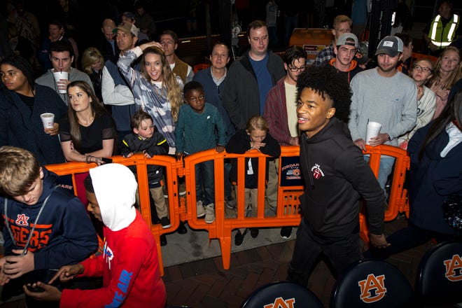 Auburn basketball signee Sharife Cooper joins fans during the inaugural Tipoff at Toomer's event in Auburn, Ala., on Thursday, Oct. 17, 2019.