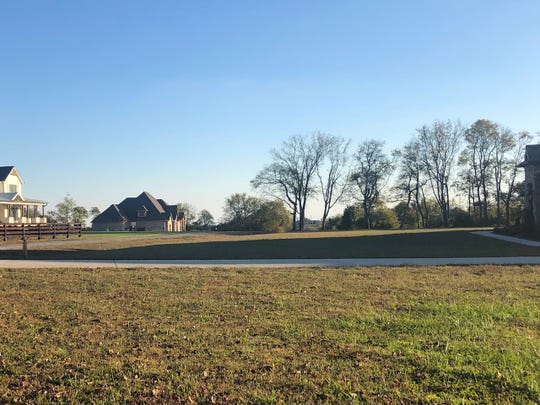 Six couples purchased 32 acres of farmland in Hendersonville and subdivided it. Each home is on 5 or 6 acres.