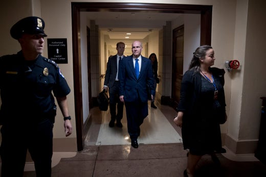 Michael McKinley, a former top aide to Secretary of State Mike Pompeo, leaves Capitol Hill in Washington, Oct. 16, 2019, after testifying before congressional lawmakers as part of the House impeachment inquiry into President Donald Trump. McKinley told lawmakers he quit his State Department position because of growing frustration with Pompeo's refusal to defend career diplomats who felt sidelined by Giuliani's pressure campaign in Ukraine, according to multiple media reports.