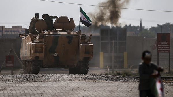 Turkish-backed Syrian opposition fighters on an ar