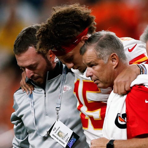 Chiefs quarterback Patrick Mahomes is helped off t