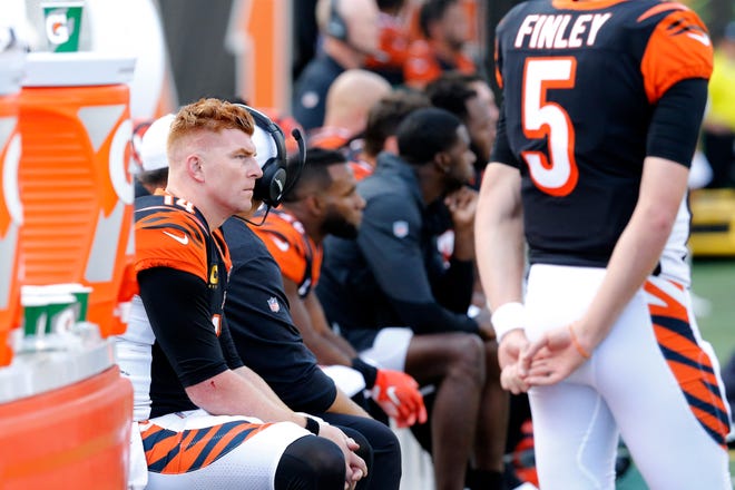 Cincinnati Bengals quarterback Andy Dalton (14) looks on from the bench in the fourth quarter of the NFL Week 7 game between the Cincinnati Bengals and the Jacksonville Jaguars at Paul Brown Stadium in downtown Cincinnati on Sunday, Oct. 20, 2019. The Bengals fell to 0-7 on the season with a 27-17 loss at home.
