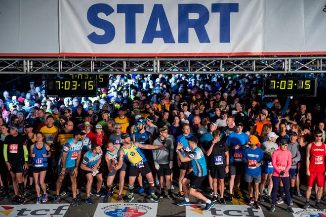 Runners take a selfie on the starting line during the 42nd Annual Detroit Free Press/TCF Bank Marathon in Detroit on Sunday, Oct. 20, 2019.