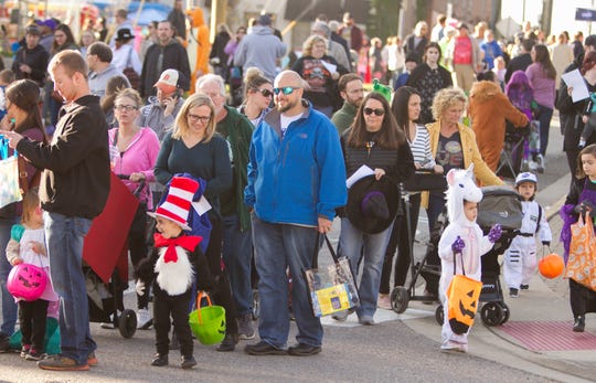 Trick-or-treaters pack downtown Howell for Legend of Sleepy Howell, Saturday, Oct. 19, 2019. This year's event will be a drive-thru experience due to the pandemic.