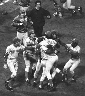 OCTOBER 22, 1975: The Reds celebrate at Fenway Park after winning Game 7 of the 1975 World Series against the Boston Red Sox.