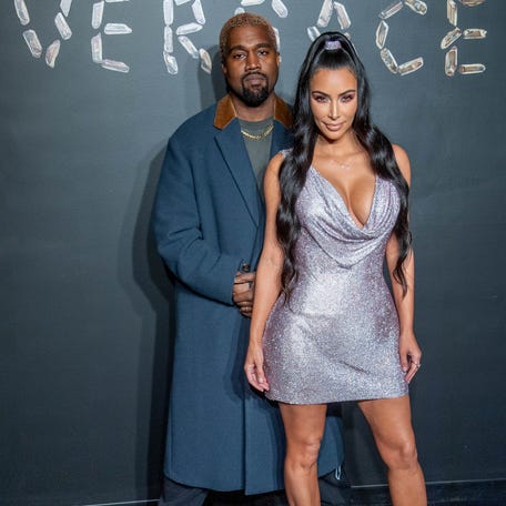 NEW YORK, NEW YORK - DECEMBER 02: Kanye West and Kim Kardashian West attend the the Versace fall 2019 fashion show at the American Stock Exchange Building in lower Manhattan on December 02, 2018 in New York City. (Photo by Roy Rochlin/Getty Images) ORG XMIT: 775265688 ORIG FILE ID: 1076421838
