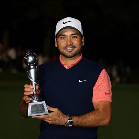 Jason Day poses with the trophy after The Challeng