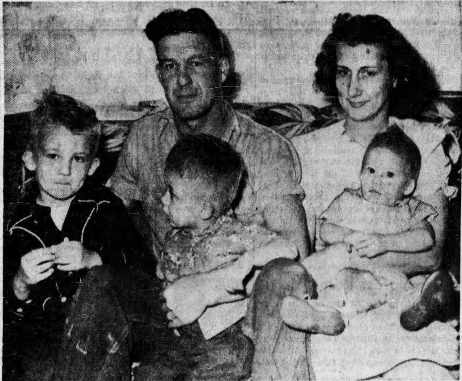 Marine Cpl. Harold "Pie" Keller poses with his family in 1950. The Marines revealed Keller was one of six Marines depicted in the famous photo of raising a flag on Iwo Jima, correcting a 74-year-old error.