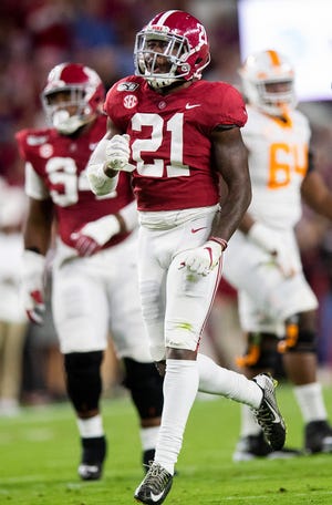Alabama defensive back Jared Mayden (21) celebrates an interception against Tennessee at Bryant-Denny Stadium in Tuscaloosa, Ala., on Saturday October 19, 2019.