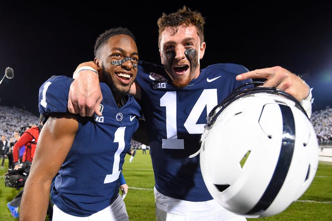 Oct 19, 2019; University Park, PA, USA; Penn State Nittany Lions wide receiver KJ Hamler (1) and quarterback Sean Clifford (14) celebrate following the game against the Michigan Wolverines at Beaver Stadium. Mandatory Credit: Rich Barnes-USA TODAY Sports