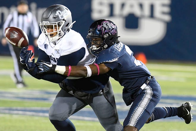 Before he transferred to Texas State, safety Troy Lefeged Jr. was a key part of Utah State's defense. Here he breaks up a pass intended for Nevada tight end Crishaun Lappin in their 2019 game in Logan, Utah. Lefeged led Utah State in tackles that season.