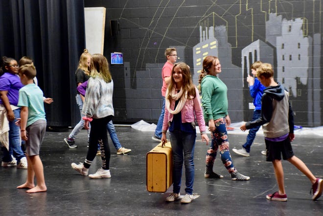 Kate Collins Middle School students rehearse on Oct. 15 for their production of Thoroughly Modern Millie, the school's first musical with Choral Music Director Flint Dollar.