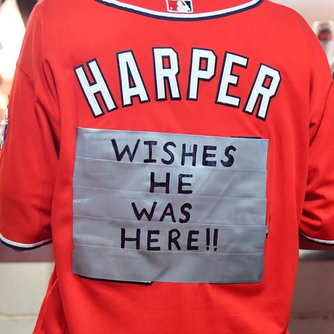 A fan mocks Bryce Harper during the NLCS.