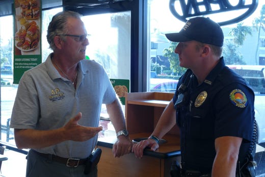Marco Island resident and contractor Alex Barker speaks with officer Josh Ferris at Coffee with a Cop in a Subway on Oct. 23. &quot;I think is good to know who the police officers are,&quot; Barker said.