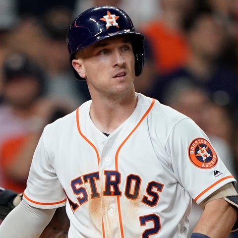 Alex Bregman reacts after striking out in the nint
