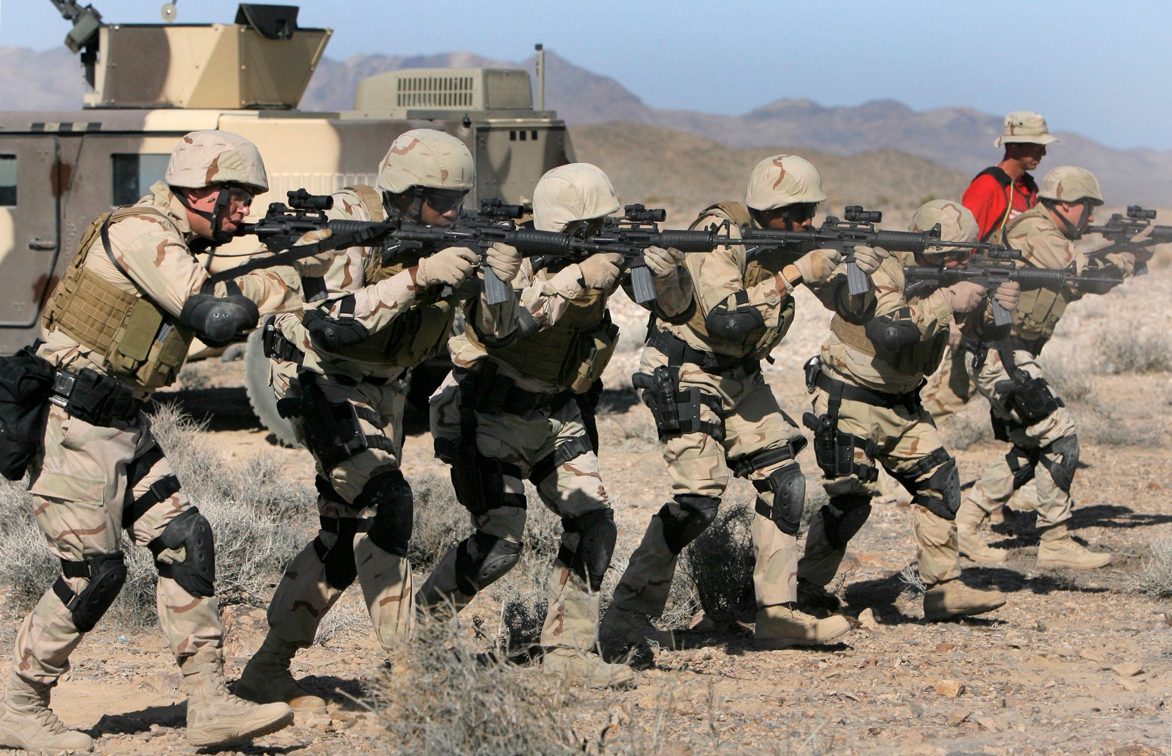 Private security officers with G4S fire M4 carbine rifles as they train during a paramilitary training at the Nevada Test Site in Mercury, Nev., about 65 miles from Las Vegas in 2007. G4S has held thousands of government contracts, including guard details at nuclear facilities for the Department of Energy. The company inherited much of that business after acquiring Wackenhut but sold a subsidiary specific to public contracts in 2014. G4S says 11 percent of its revenue today comes from government clients.