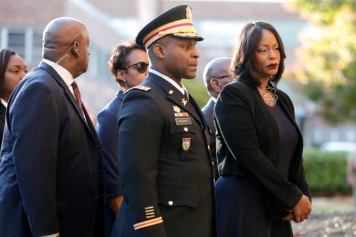 Mourners, including Maya Rockeymoore, right, widow of U.S. Rep. Elijah Cummings follow behind pallbearers walking with the congressman&#39;s body while arriving at Morgan State University ahead of a public viewing, Oct. 23, 2019, in Baltimore.&nbsp;