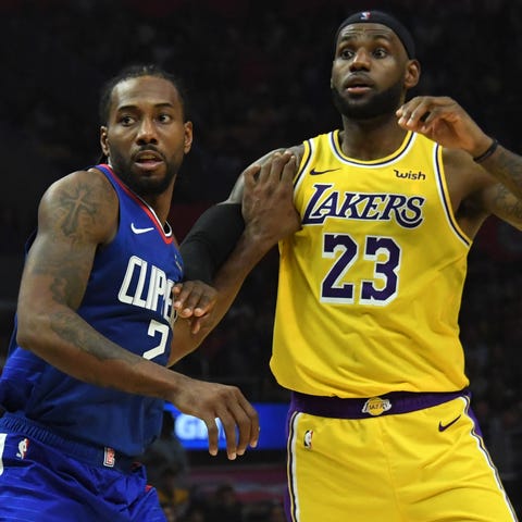 Oct. 22: Lakers forward LeBron James fights for po