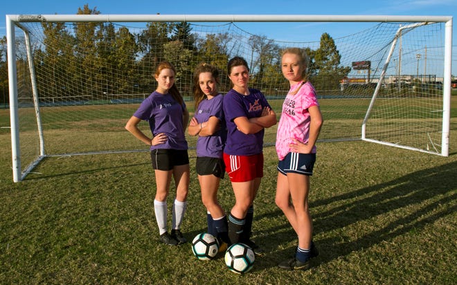 The Goebel quadruplets, from left, Danielle, Lauren, Sierra and Cassidy. The sisters are senior soccer players for Evansville Day School who just one their first regional title in program history. 