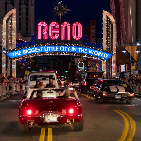 Classic cars cruise under the iconic Reno Arch in 