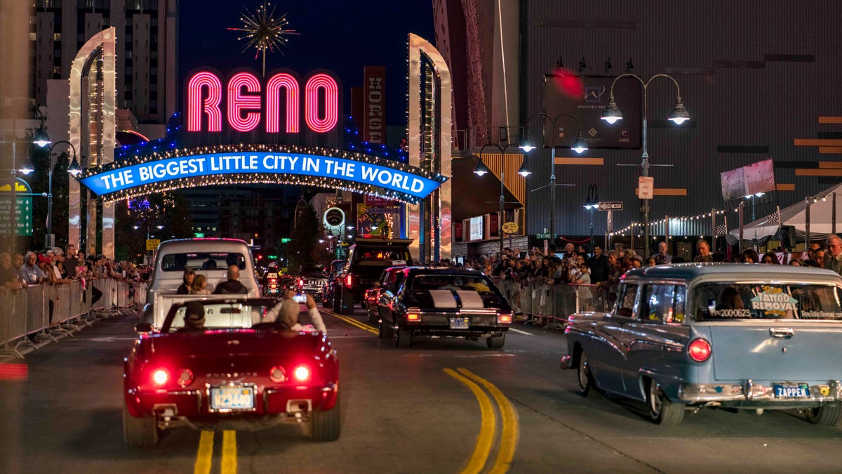 Classic cars cruise under the iconic Reno Arch in downtown as part of Hot August Nights in August. Reno's downtown is still dominated by hotel casinos as the city works to reinvent itself as a high-tech mecca.