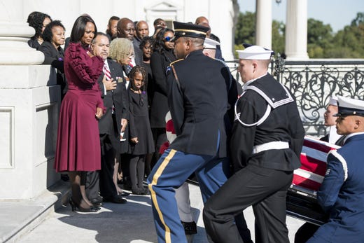 Maya Rockeymoore, widow of Rep. Elijah Cummings D-Md is joined by family members as Cummings&#39; flag-draped casket is escorted up the East Front Steps of the U.S. Capitol by a military honor guard prior to lying in state inside Statuary Hall during a memorial service Oct. 24, 2019 in Washington, DC.