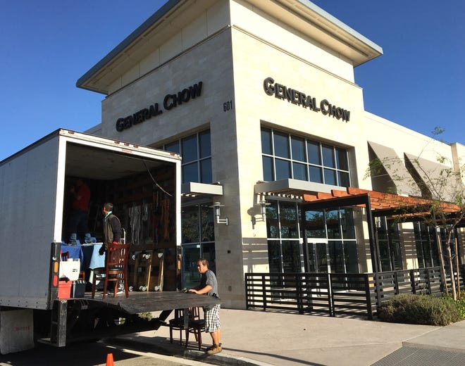 Workers move furniture and kitchen equipment into a van in front of General Chow Dumpling House & Bar at The Collection at RiverPark in Oxnard. The restaurant closed this week.
