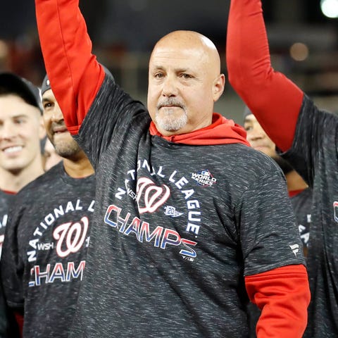 Nationals GM Mike Rizzo hoists the NL championship