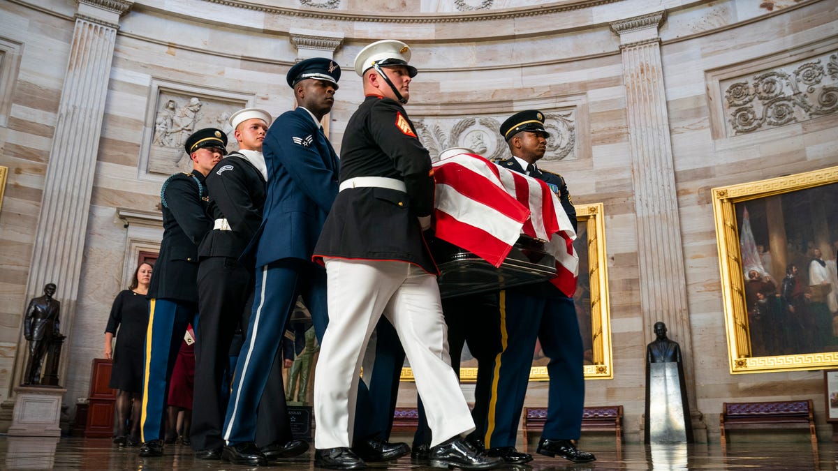 Joint service members of a military casket team carry the casket of late Rep. Elijah Cummings, D-Md., into the rotunda of the Capitol in Washington, Oct. 24, 2019.