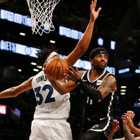 Brooklyn Nets guard Kyrie Irving (11) attempts a p