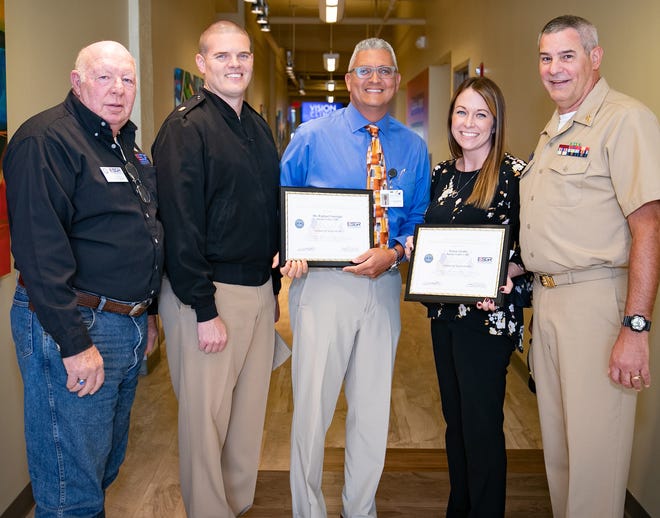 From left are retired Lt. Col. John Salchow; Lt. Cmdr. Jason Moody, commanding officer; Dr. Rafael Santiago with Jordan Valley Community Health Center; Tracie Grube, also with the health center; and Brady Stark, Jordan Valley physician assistant and nominating Guard member, chief petty officer with the U.S. Navy Reserve Unit.
