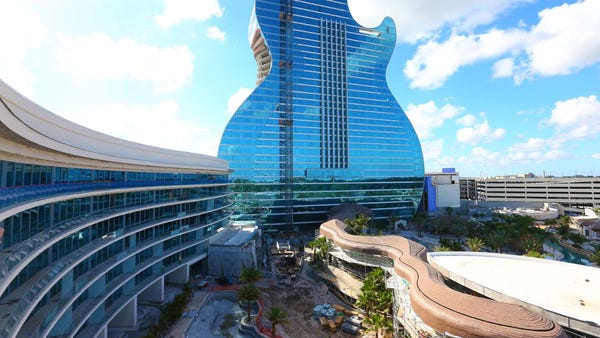 The guitar building boasts 638 guest rooms and sui