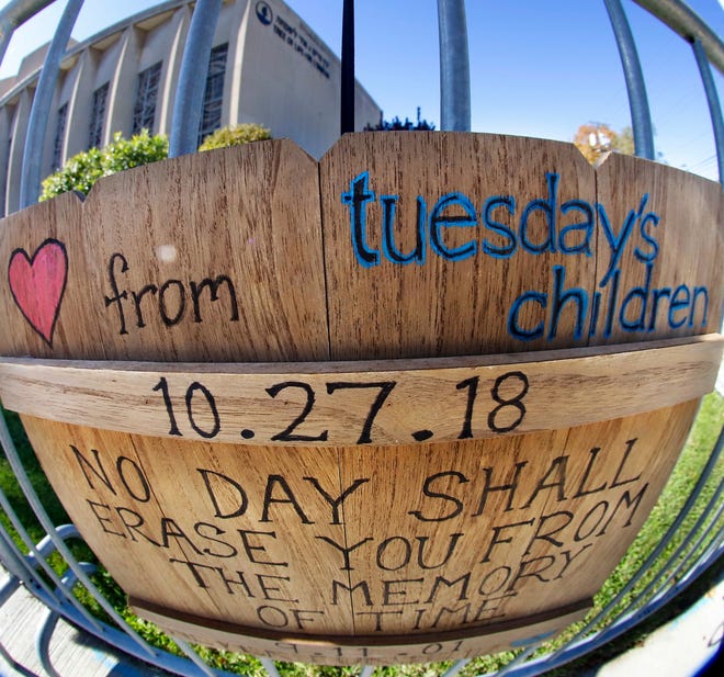 A sign marking the Tree of Life shooting on a barricade around the synagogue in Pittsburgh on Oct. 24, 2019.