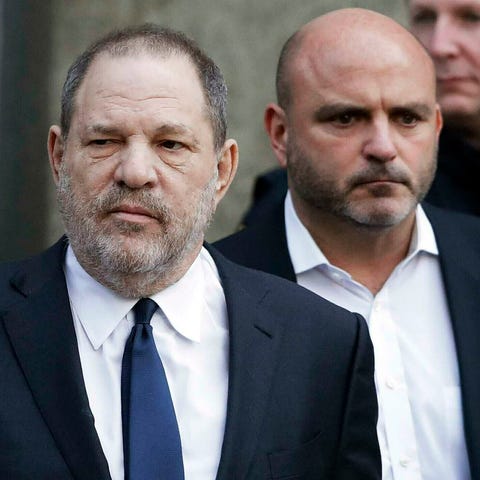Harvey Weinstein, center, leaves New York Supreme 