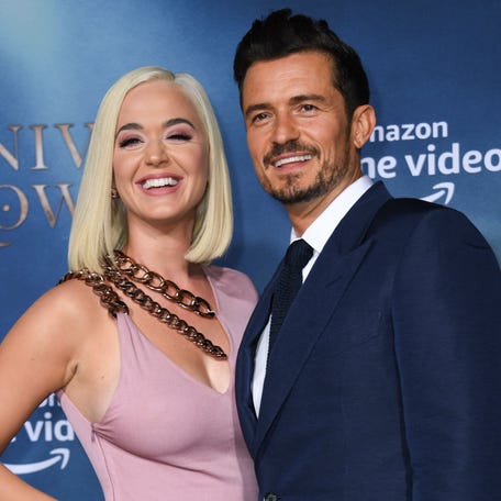 British actor Orlando Bloom and US singer/songwriter Katy Perry arrive for the Los Angeles premiere of Amazon Original Series "Carnival Row" at the TCL Chinese theatre on August 21, 2019 in Hollywood. (Photo by VALERIE MACON / AFP)VALERIE MACON/AFP/Getty Images ORG XMIT: "Carnival ORIG FILE ID: AFP_1JO4L0