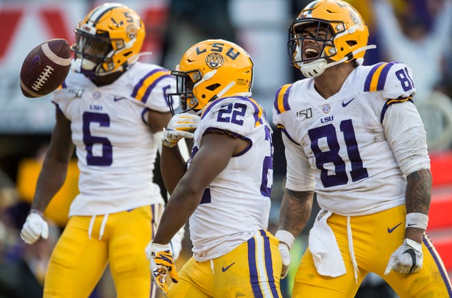 LSU running back Clyde Edwards-Helaire (22) celebrates after scoring a touchdown at Tiger Stadium in Baton Rouge, La., on Saturday, Oct. 26, 2019. LSU defeated Auburn 23-20. 