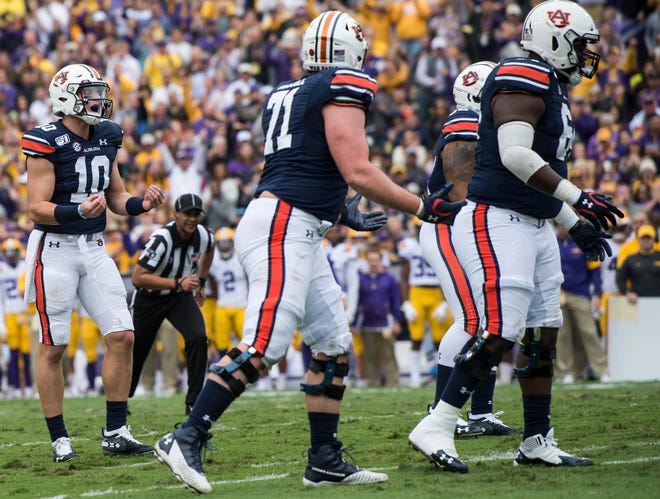 Auburn quarterback Bo Nix (10) shows his frustration after his offensive line is called for a false start penalty at Tiger Stadium in Baton Rouge, La., on Saturday, Oct. 26, 2019.