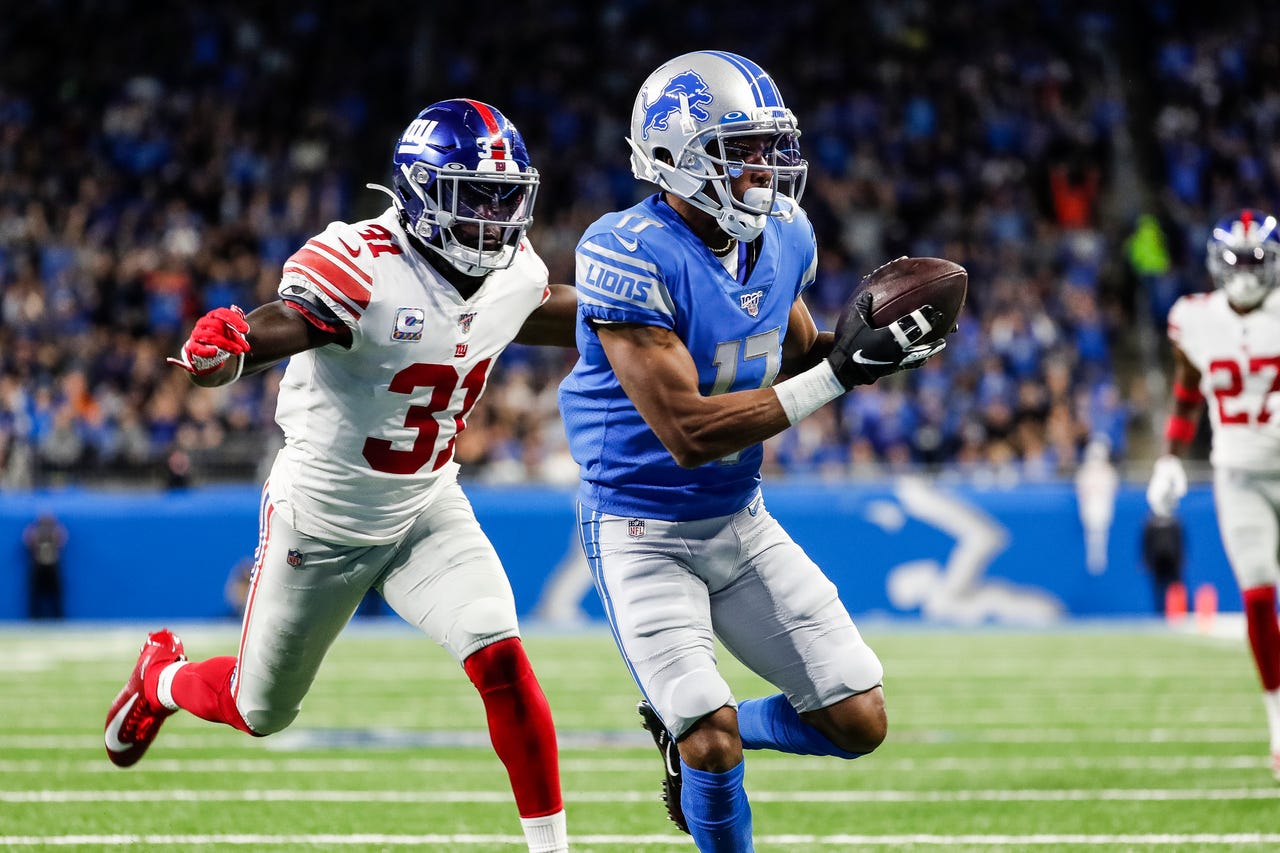 Lions wide receiver Marvin Hall makes a catch for touchdown behind Giants defensive back Michael Thomas during the first half at Ford Field  in Detroit, Sunday, Oct. 27, 2019.