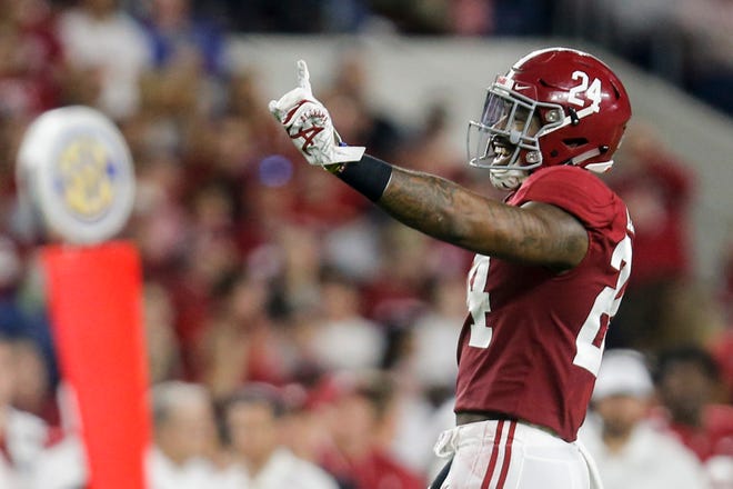 Oct 26, 2019; Tuscaloosa, AL, USA; Alabama Crimson Tide linebacker Terrell Lewis (24) celebrates after deflecting a pass from Arkansas Razorbacks quarterback Nick Starkel (17) (not pictured) during the first half of an NCAA college football game at Bryant-Denny Stadium. Mandatory Credit: Butch Dill-USA TODAY Sports