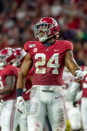 Alabama linebacker Terrell Lewis (24) grins after a stop of Arkansas during the first half of an NCAA college football game, Saturday, Oct. 26, 2019, in Tuscaloosa, Ala. (AP Photo/Vasha Hunt)
