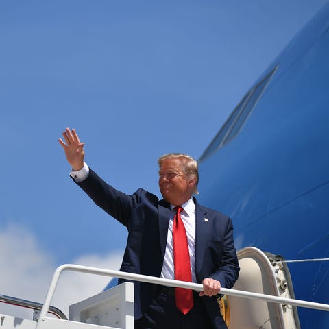 President Donald Trump boards Air Force One on Aug