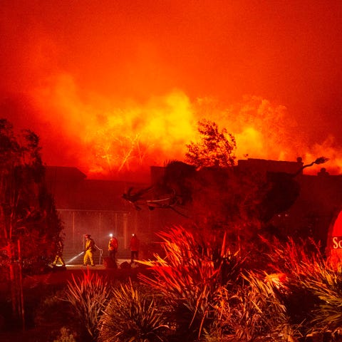 Firefighters survey Soda Rock Winery as it begins 