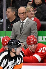Detroit Red Wings head coach Jeff Blashill, top, watches his team play against the St. Louis Blues in the first period.