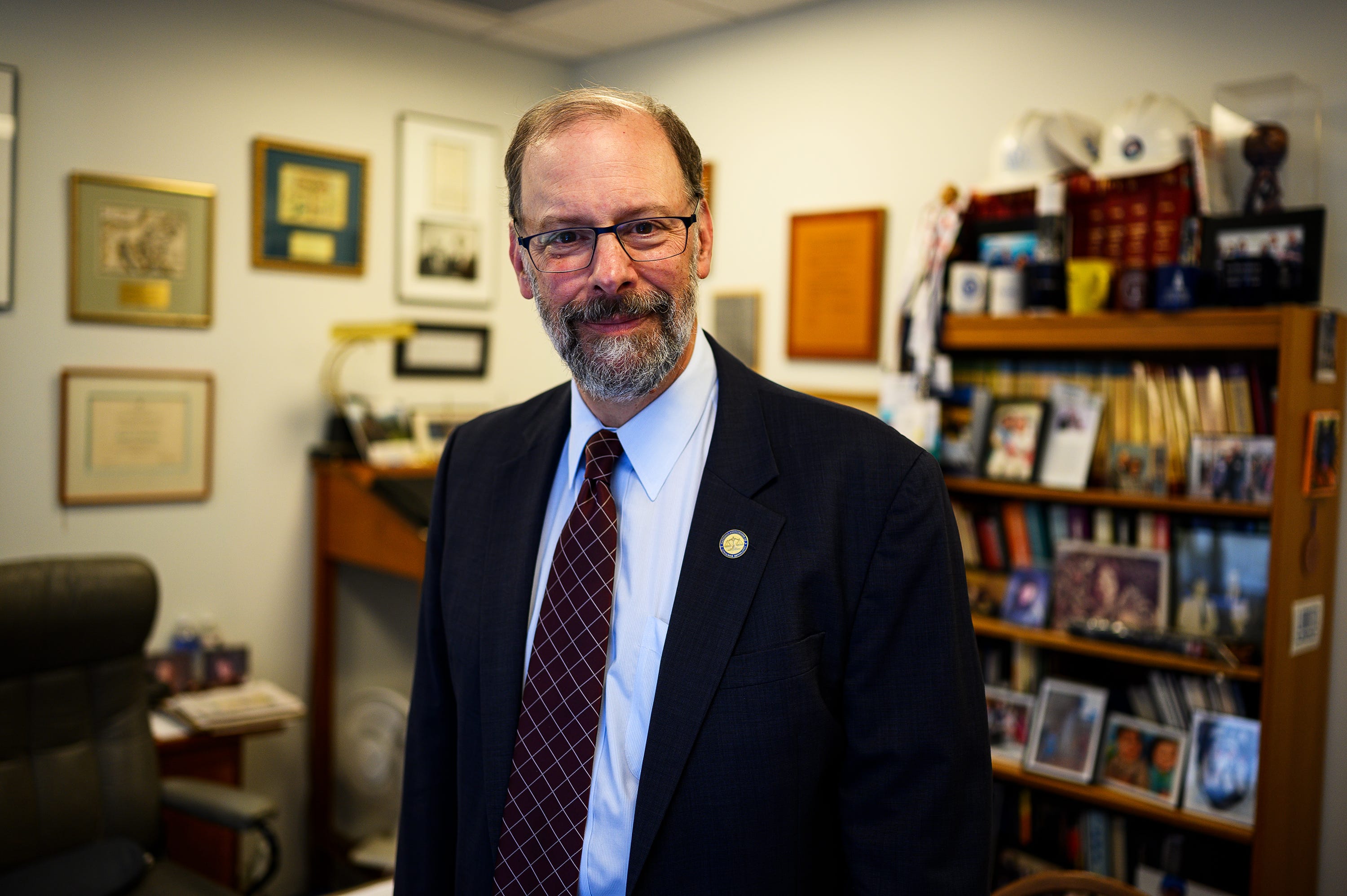 Stuart Rossman of the National Consumer Law Center in Boston poses for a portrait in his office in August.