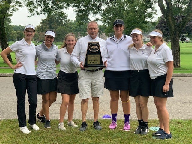 The St. Catherine golf team poses with its trophy after qualifying for the state competition.