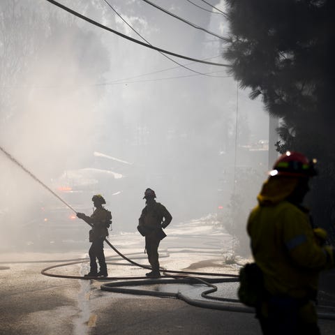 Los Angeles County Firefighters put out a house fi