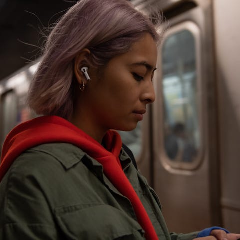 A listener wearing Apple's new AirPods Pro earbuds
