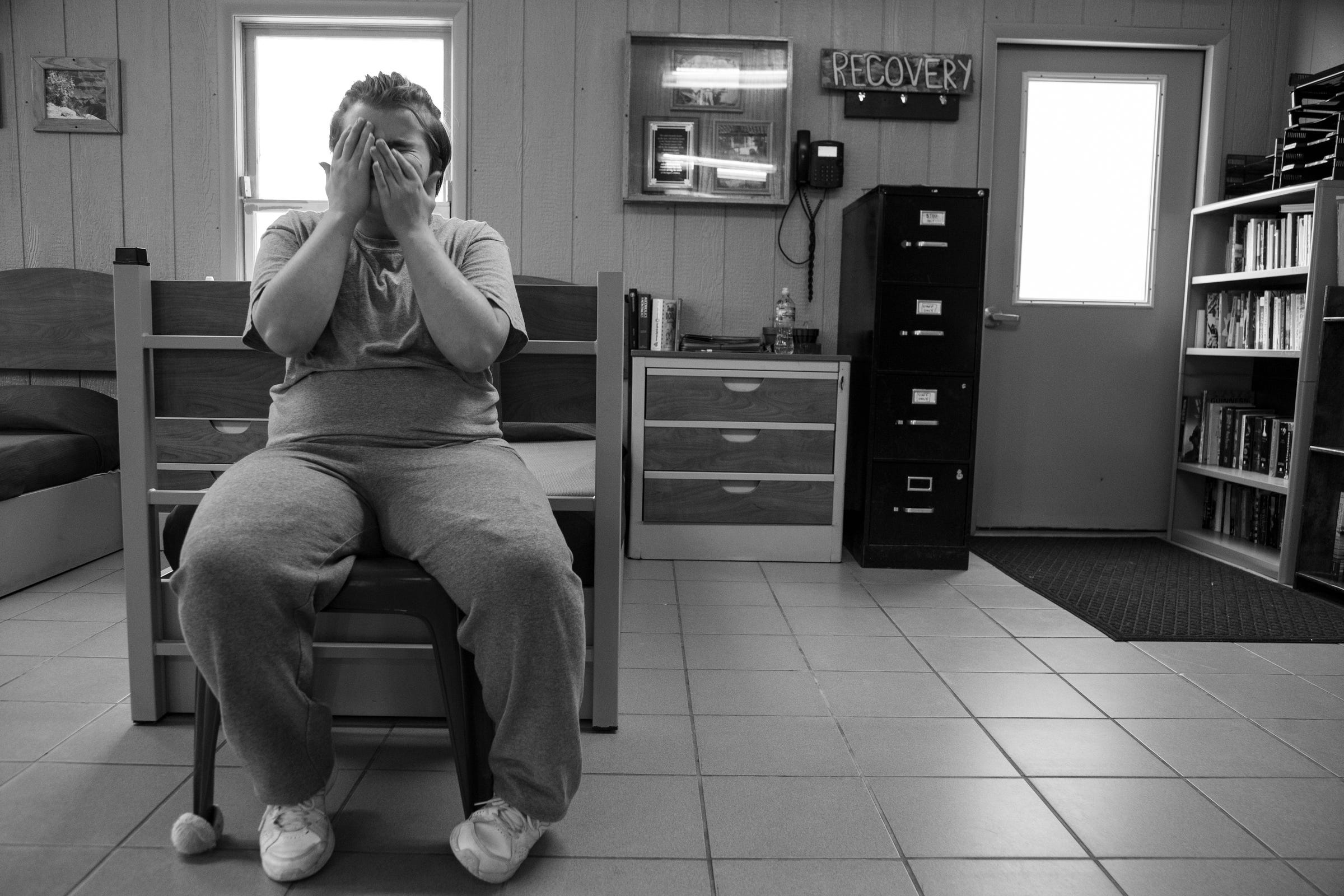 The Girl From Taylor sits in a chair by her bed Thursday, July 25, 2019, she along with other clients were court ordered to Wolverine Growth and Recovery Services in Vassar, a program designed to intervene with alcohol, drug and behavioral issues.